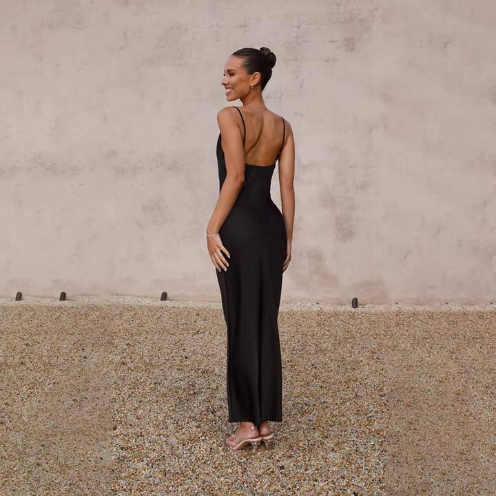 Women's wedding guest maxi dress with an elegant open back, perfect for special occasions.