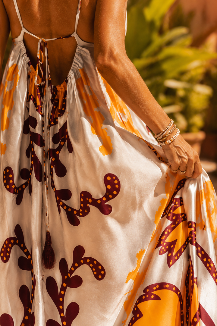 Vibrant orange women's maxi dress, a stylish and comfortable holiday dress for elegant resort wear.