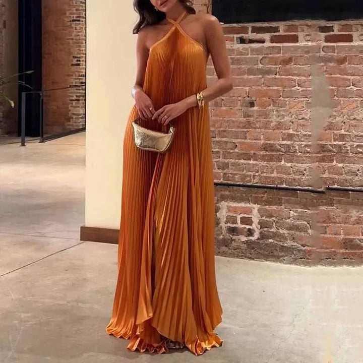 Elegant orange pleated halter maxi dress for women, perfect for wedding guests or formal evening special occasions.