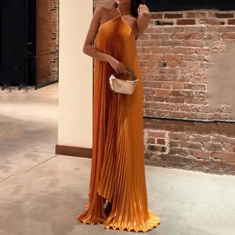 Orange pleated maxi halter dress for women. A stunning, elegant choice for wedding guests, formal events, and special occasions.
