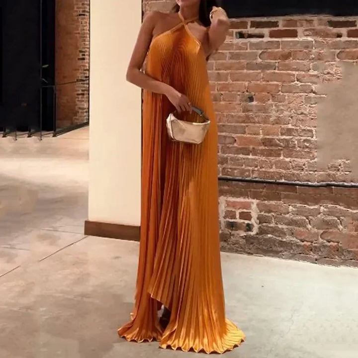 Orange pleated maxi halter dress for women. A stunning, elegant choice for wedding guests, formal events, and special occasions.