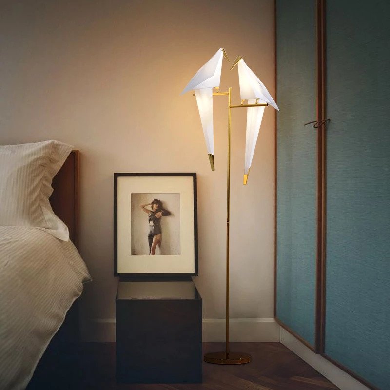 Flexible table or floor origami bird lamp, a unique decorative light for contemporary homes.
