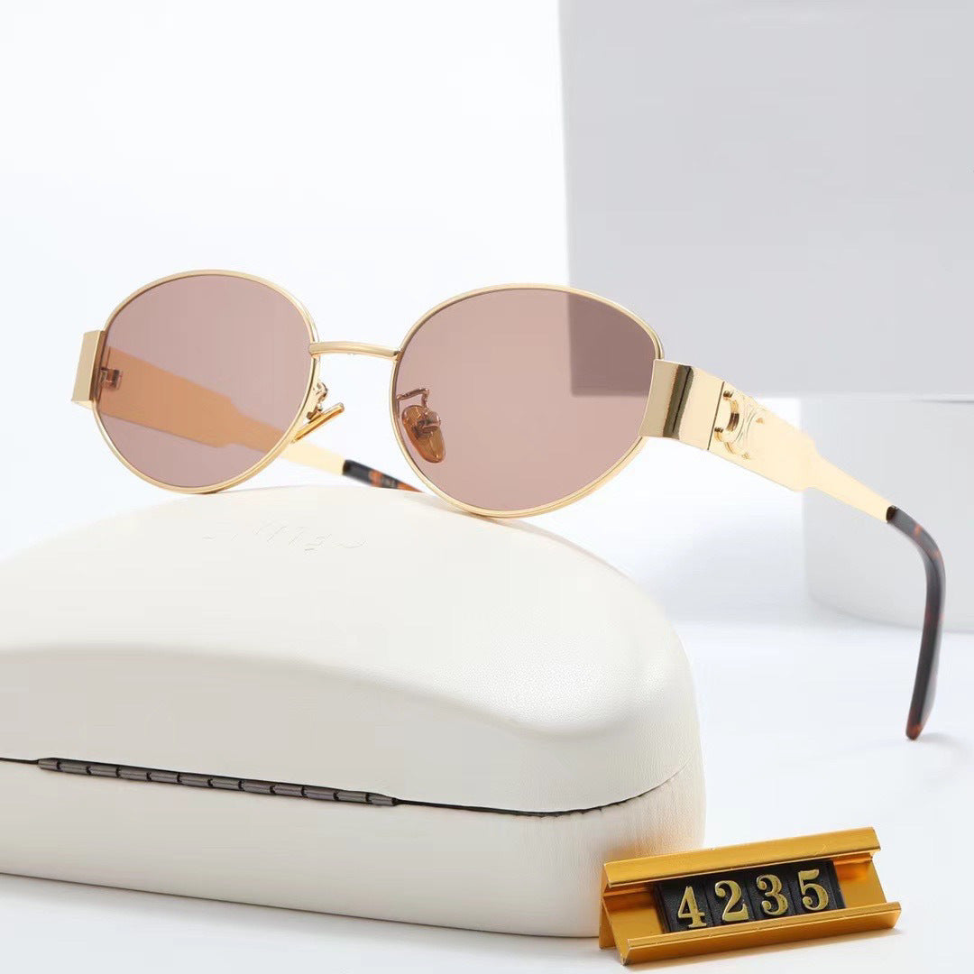 Versatile women's oval sunglasses, designer style, perfect for any look, with UV protection.