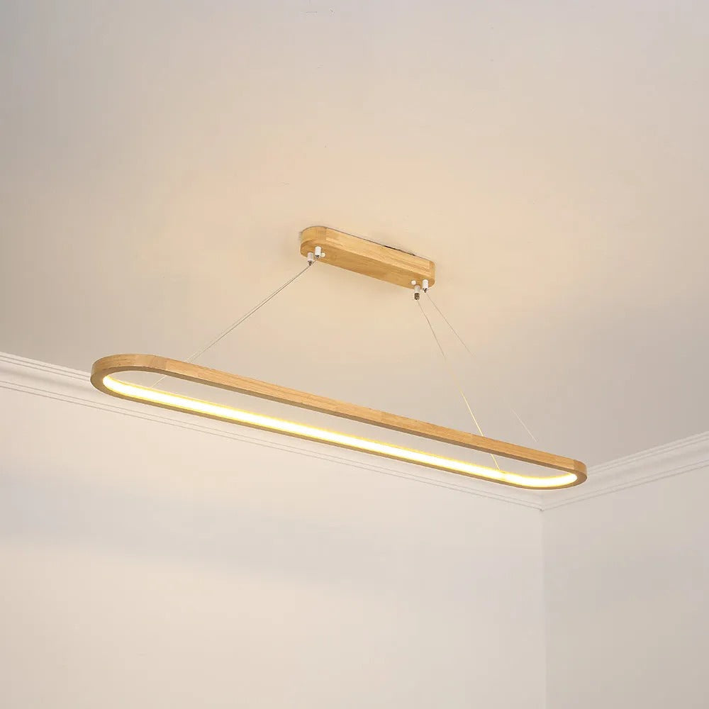 Designer oval pendant light, natural wood grain & smooth acrylic, creates inviting ambiance.