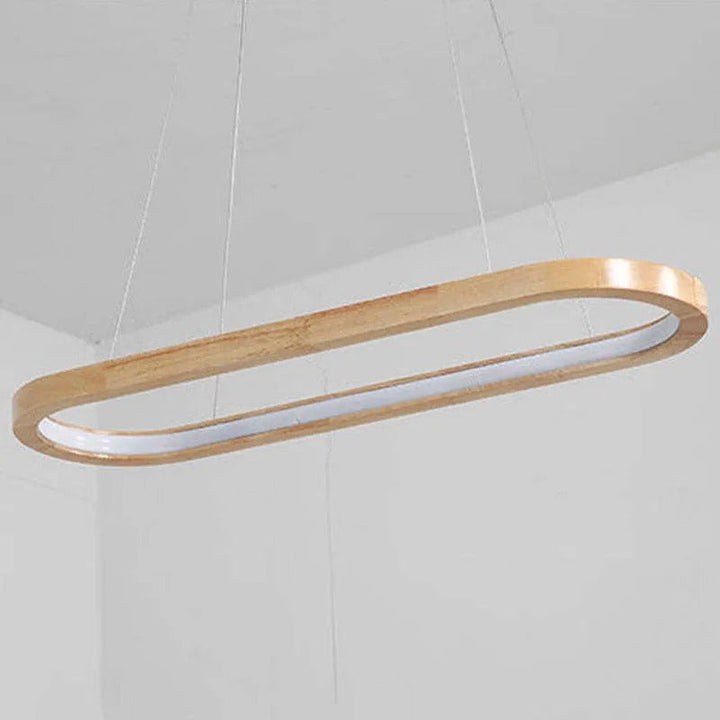 Elegant modern oval light fixture, wood accents & acrylic diffuser, perfect over kitchen islands.