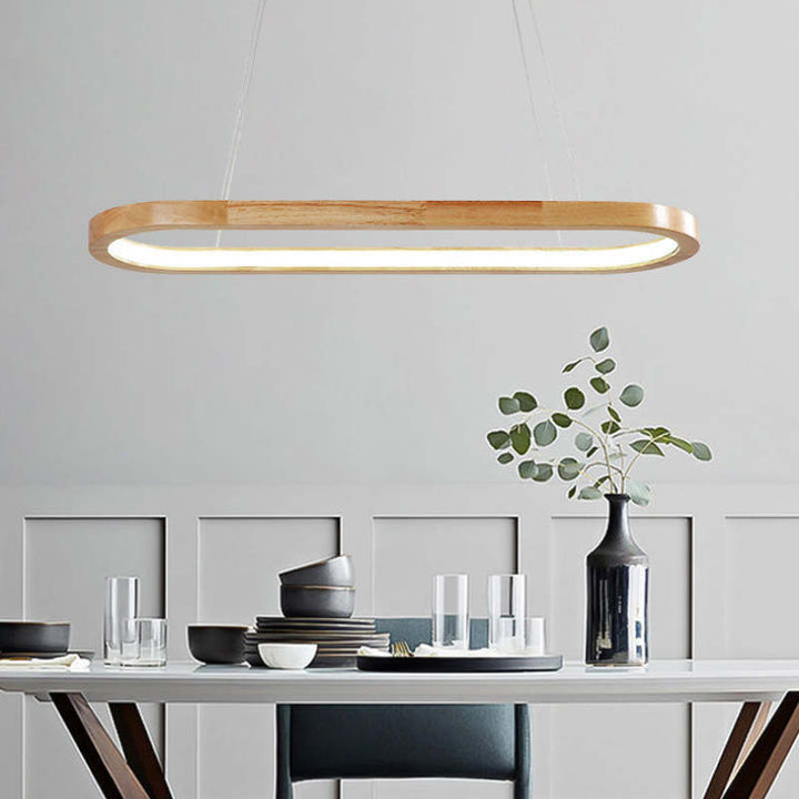 Contemporary oval pendant light with wooden frame and acrylic diffuser, ideal for kitchen islands.