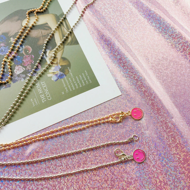 Elegant pearl bead glasses chain for women. Securely holds spectacles or sunglasses. A chic fashion accessory.