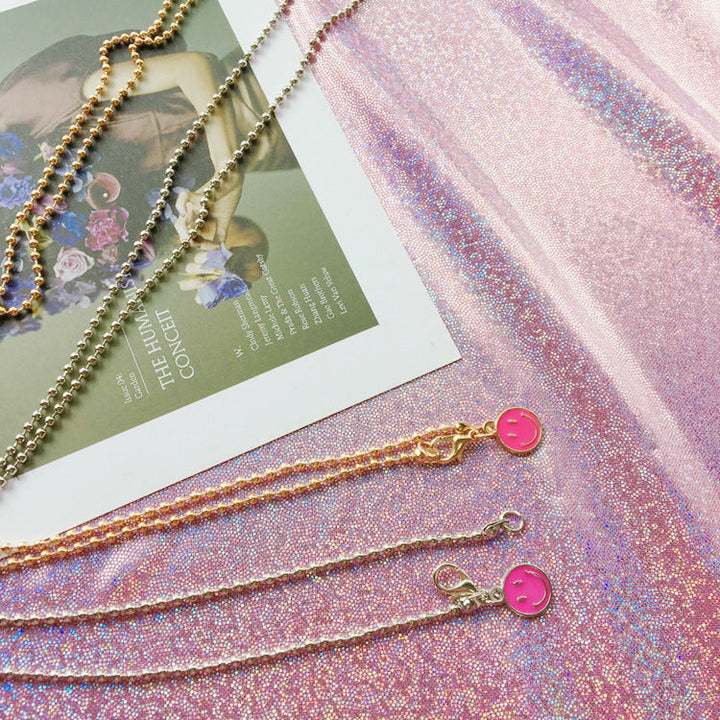 Elegant pearl bead glasses chain for women. Securely holds spectacles or sunglasses. A chic fashion accessory.