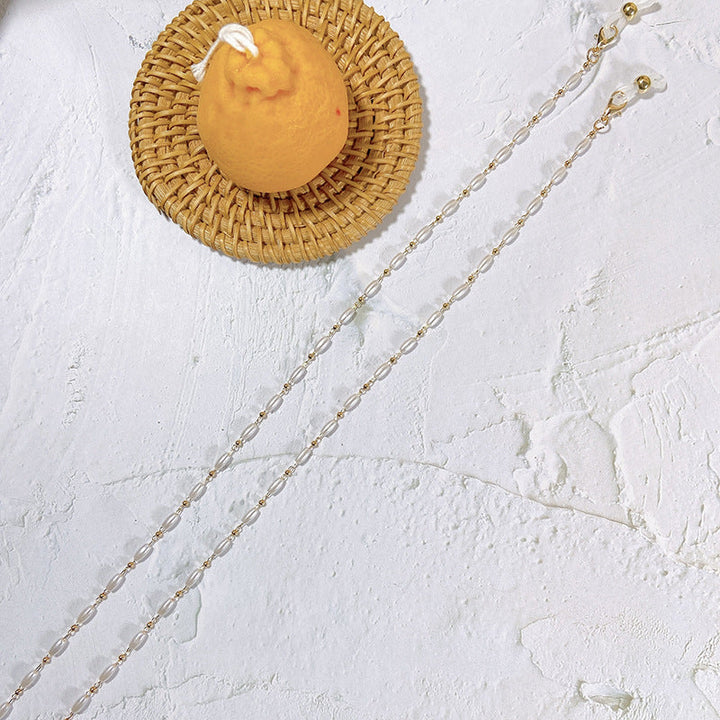 Handcrafted pearl glasses chain holder, an elegant and secure eyewear accessory for women's fashion.