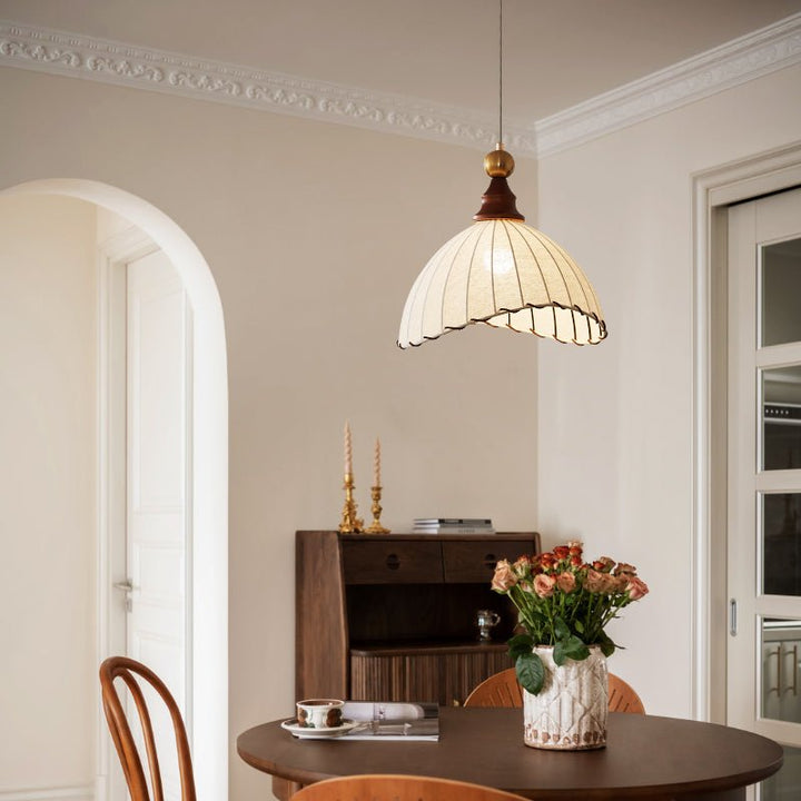 Stylish ceiling lamp: elegant fabric shade, gold accent, and wood details for home decor.