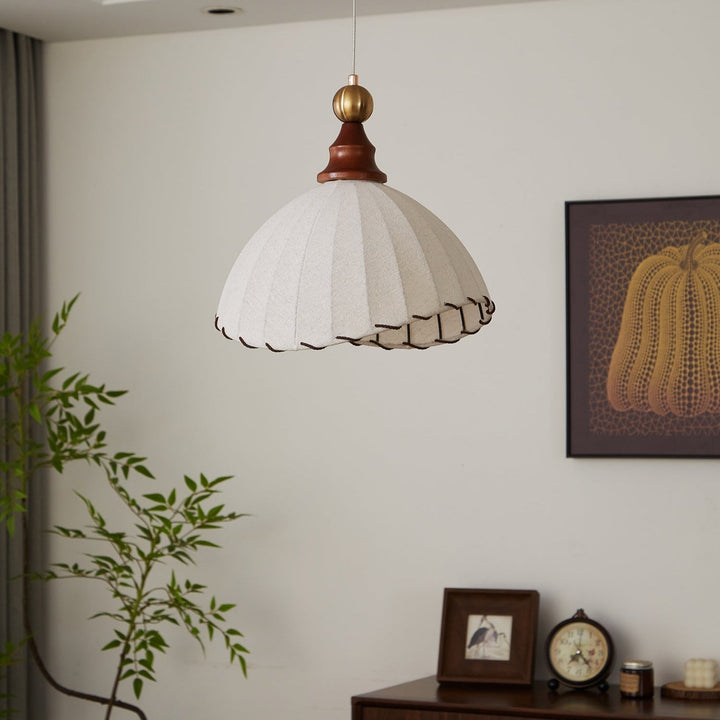 Fabric drum shade pendant light, elegant design with gold hardware and wood details.