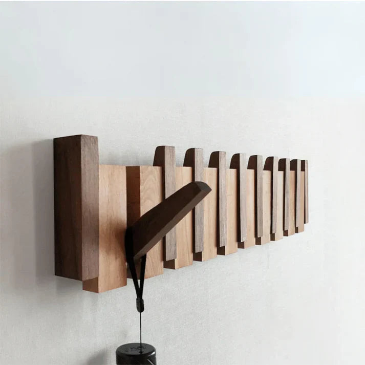 Modern beech wood piano key coat hanger, ideal musical decor for stylish entryways & hallways.