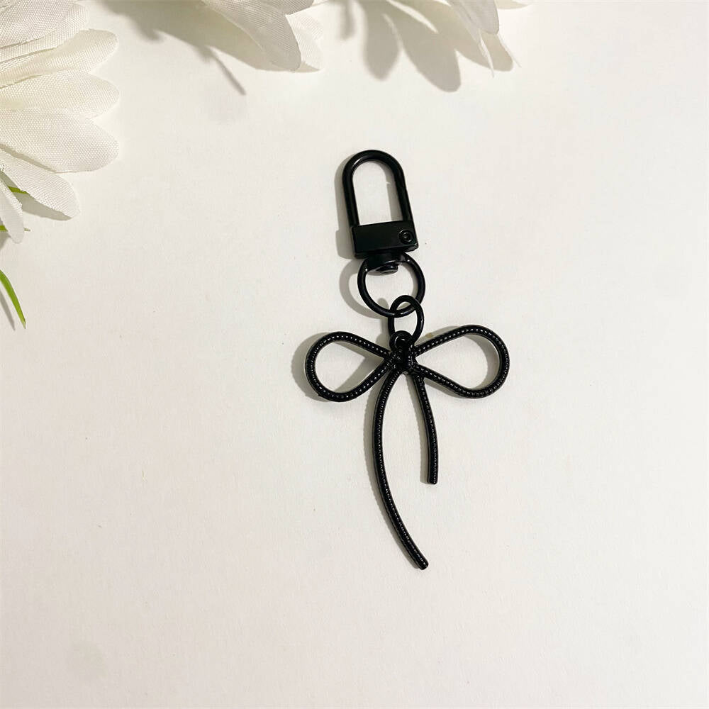 Luxurious yellow bow bag charm, a fashionable PU leather key holder for women.