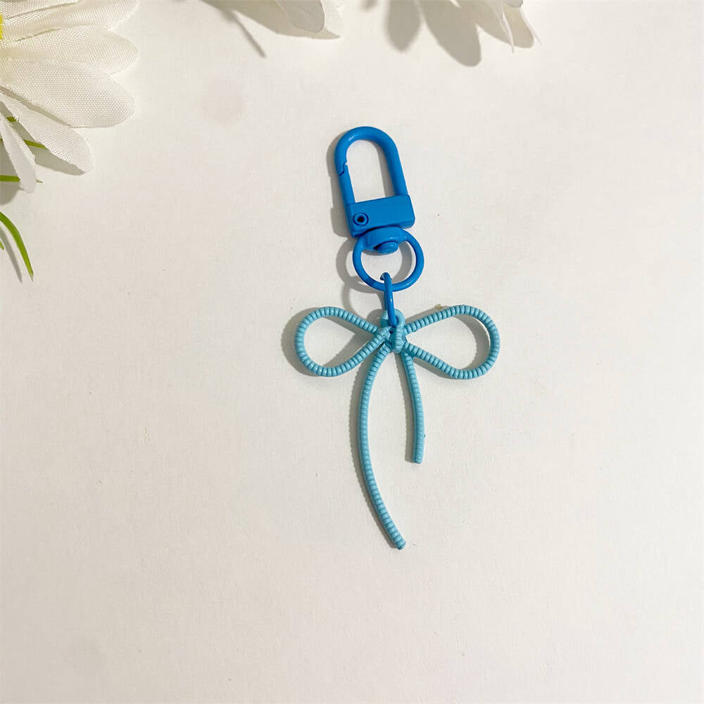 Green elegant bow keychain, a unique & stylish bag charm for keys, women's accessory.