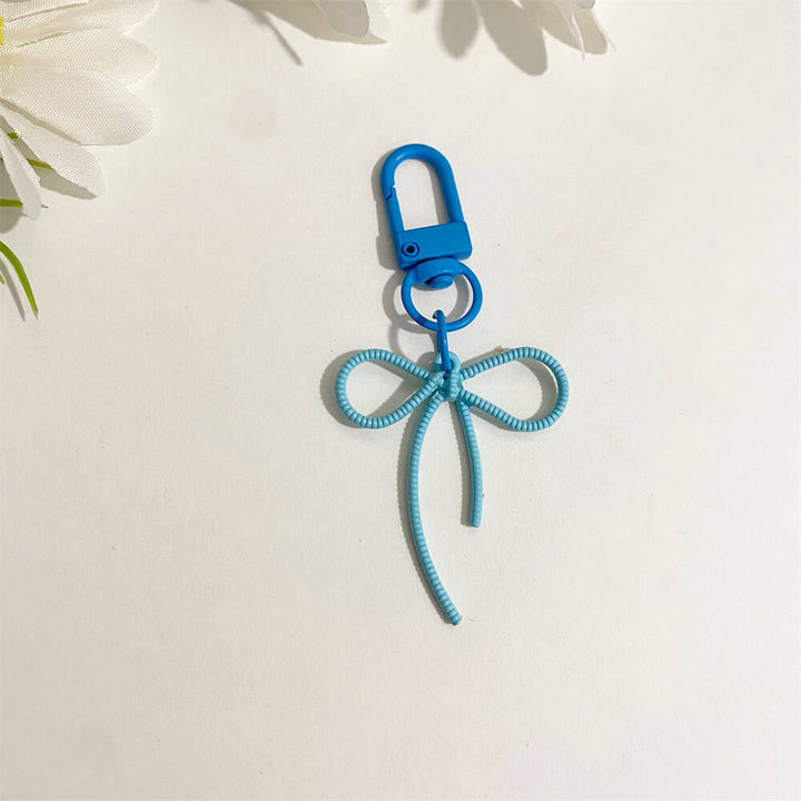 Green elegant bow keychain, a unique & stylish bag charm for keys, women's accessory.
