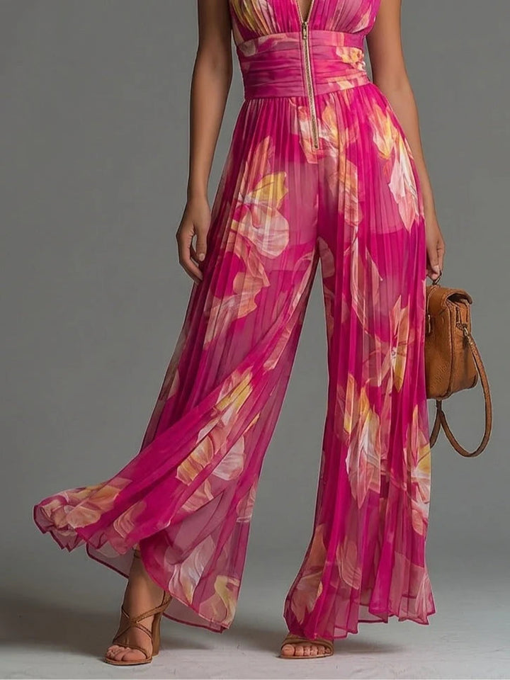 Vibrant pink floral sleeveless halter neck jumpsuit for women with a chic wide leg cut, perfect for evening wear.