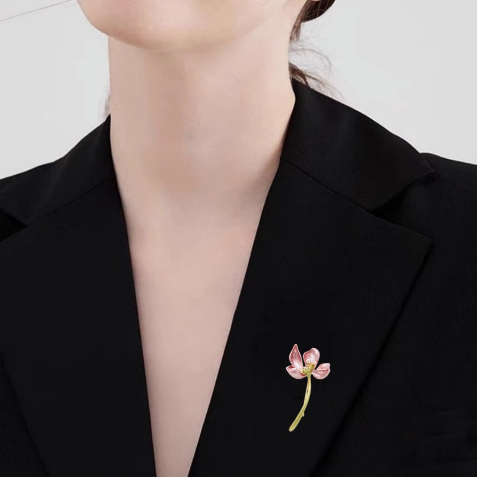 Delicate pink floral brooch, an elegant women's accessory & lapel pin for sophisticated style.