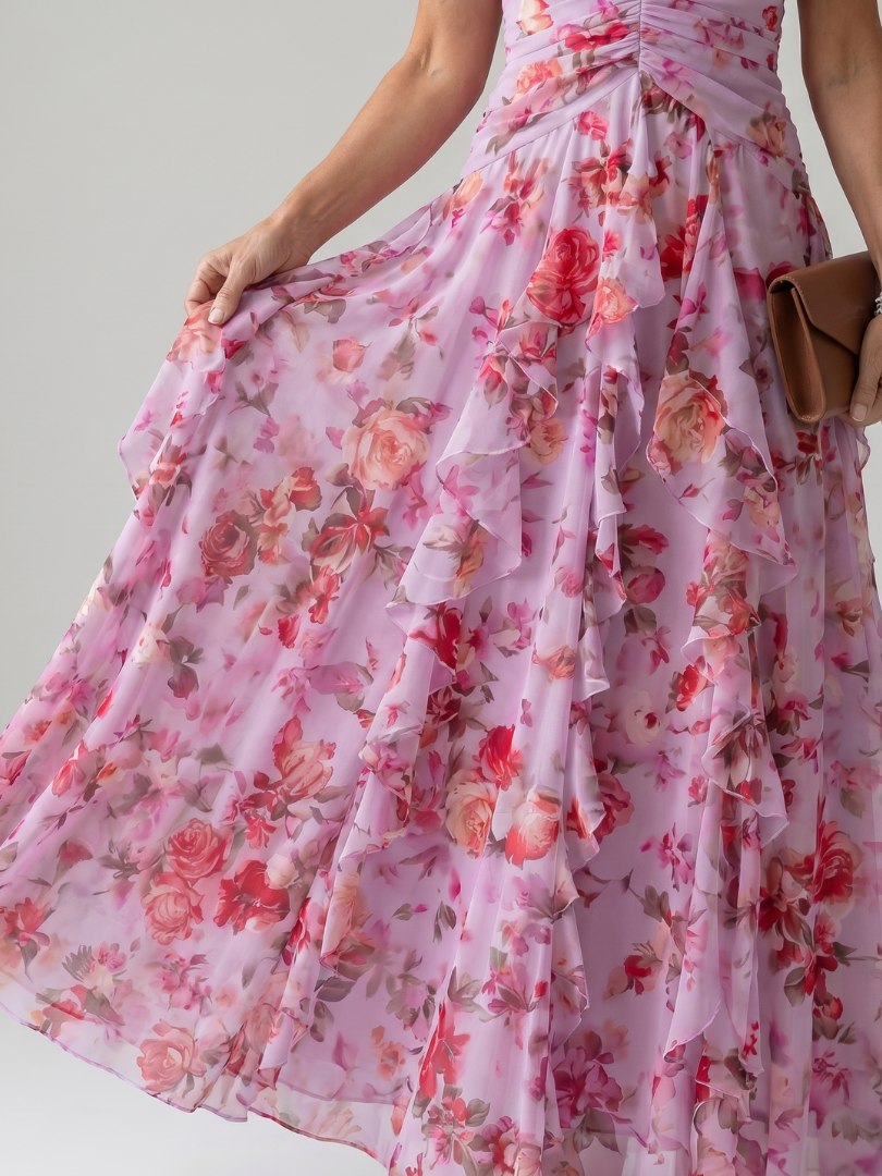 Formal women's halter neck maxi dress in pink, featuring an elegant flowy design. Perfect for special occasion parties.