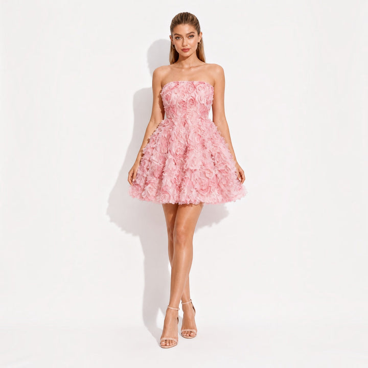 Elegant pink strapless mini dress for parties, featuring a stylish design perfect for cocktail and special occasions.