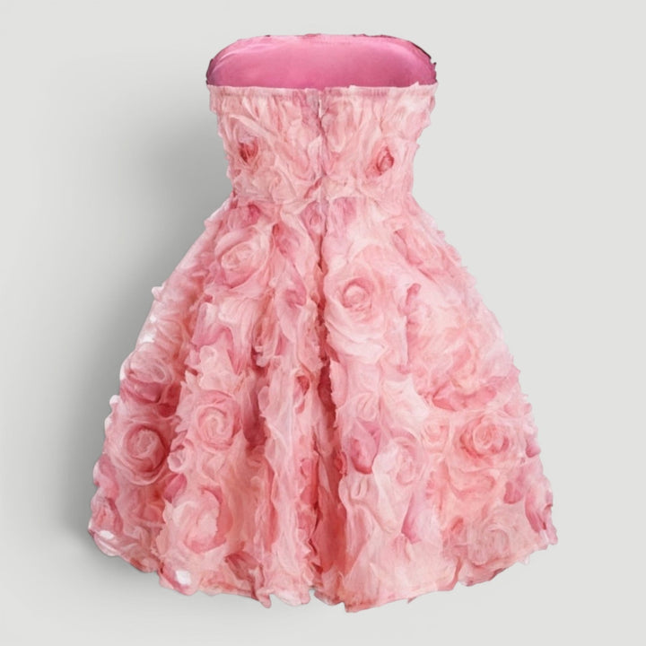 Stylish women's strapless pink mini dress, an elegant party outfit perfect for evenings and special occasions.