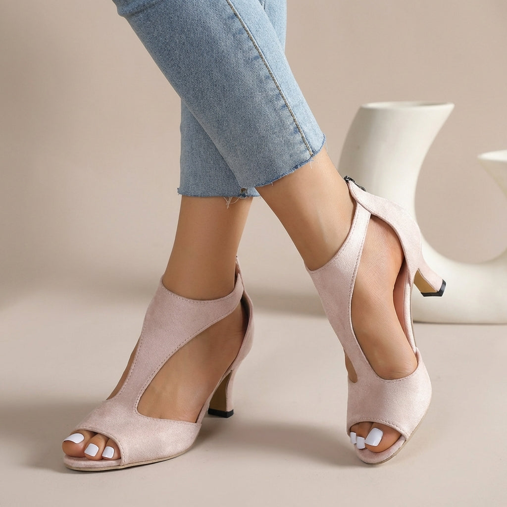 Elegant pink women's orthopedic T-strap heeled sandals for summer comfort & style. Supportive fashion footwear.