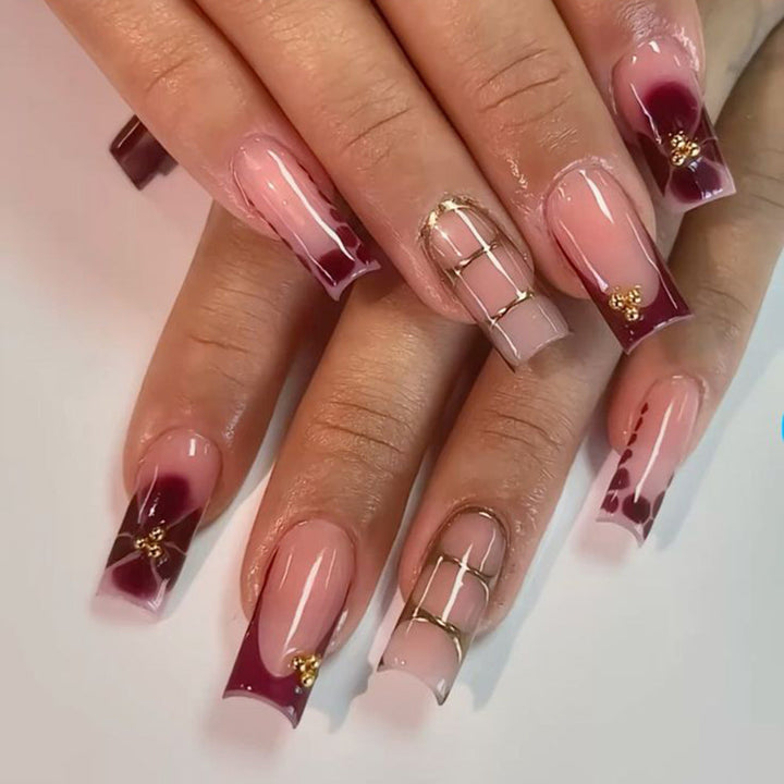 Elegant press-on nails for women, featuring intricate decorative designs, perfect for an instant glamorous manicure.