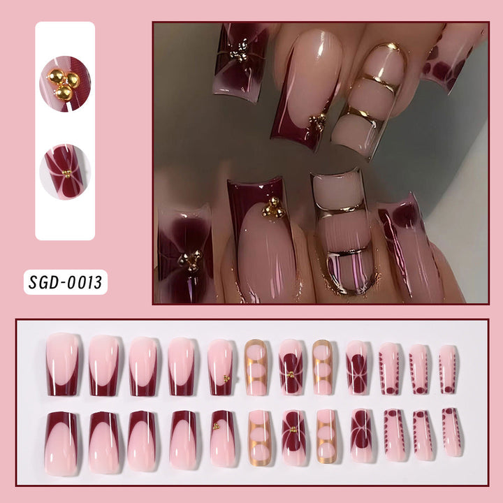 Decorative fake nails with sophisticated patterns, providing an easy and elegant nail art solution for women.