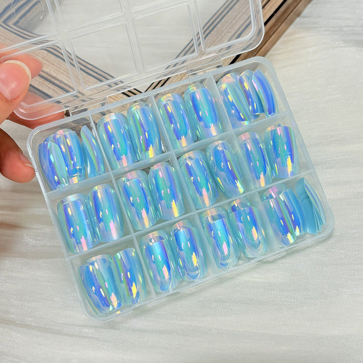 Elegant fake nails for women's instant beauty. This press-on nail art kit offers diverse designs for DIY manicures.