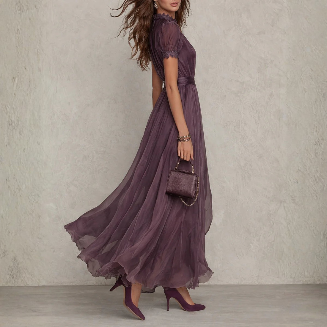 Women's formal wear: flowing purple maxi dress with delicate lace details, an elegant evening gown for special events.