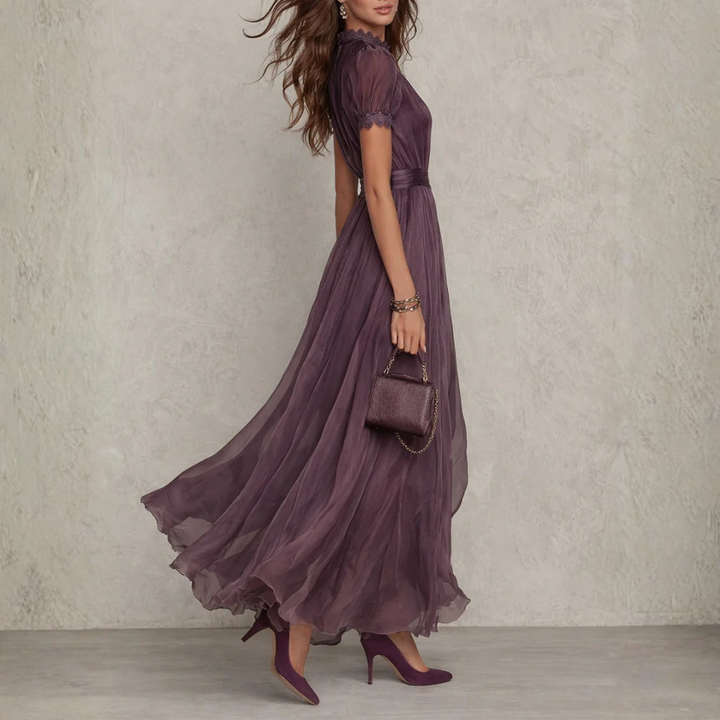 Women's formal wear: flowing purple maxi dress with delicate lace details, an elegant evening gown for special events.