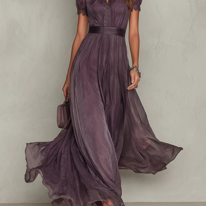 Graceful women's purple maxi dress, an elegant evening gown featuring intricate lace bodice & a flowing skirt.