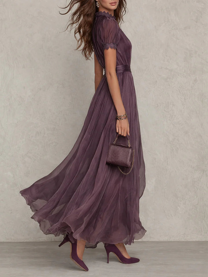 Women's formal purple maxi dress with delicate lace trim & gathered waist. Ideal for special occasionwear.
