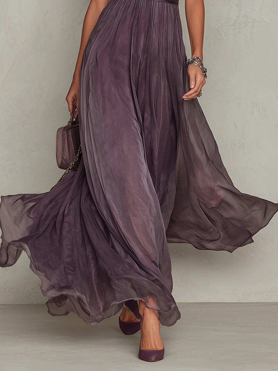 Elegant purple lace maxi dress for women. Features a gathered waist and flowing skirt. Perfect for special occasions.