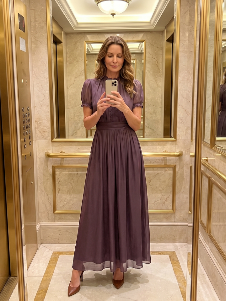 Chic purple women's maxi dress, ideal for occasion wear. Features a gathered waist, keyhole, and short sleeves.