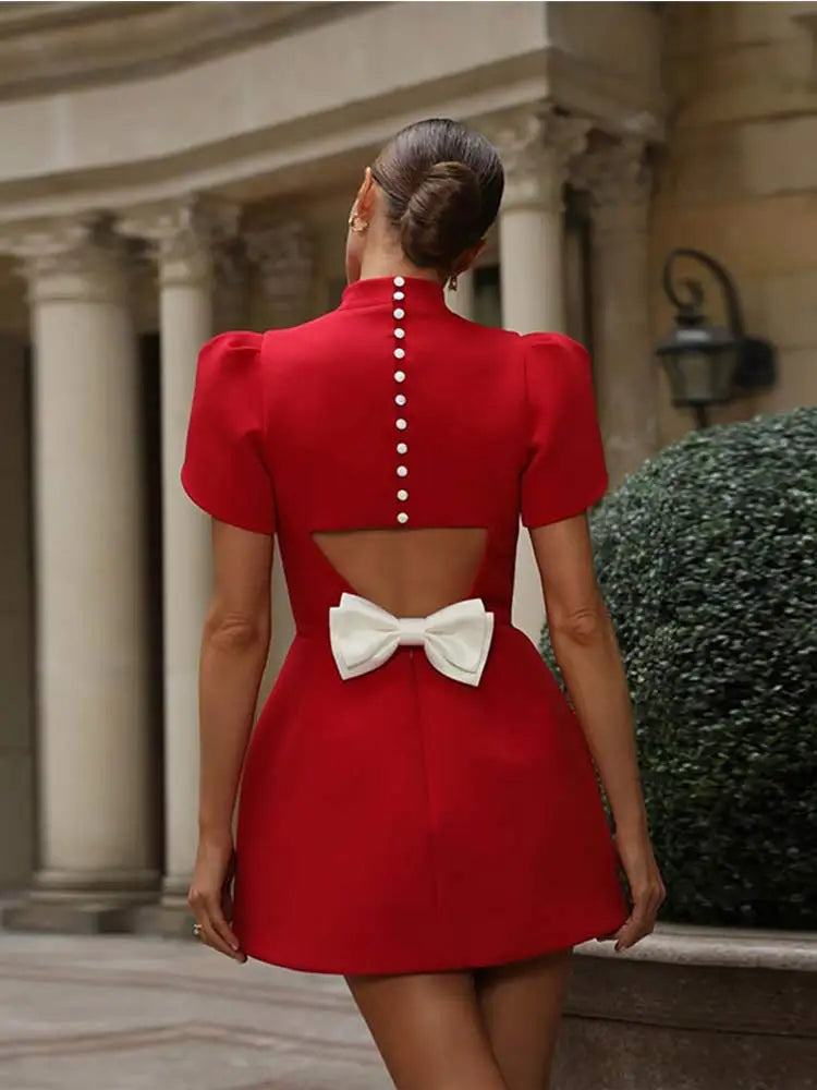 Stylish red mini dress for women, featuring hollow-out design & a chic tie detail, great for parties & summer.