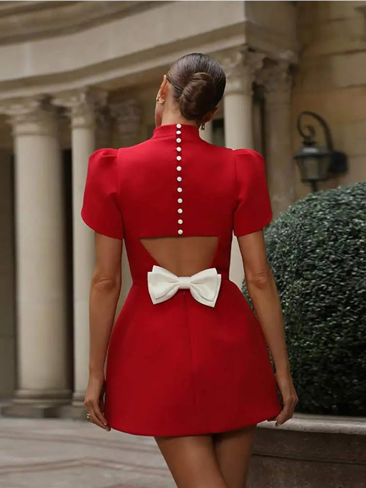 Stylish red mini dress for women, featuring hollow-out design & a chic tie detail, great for parties & summer.