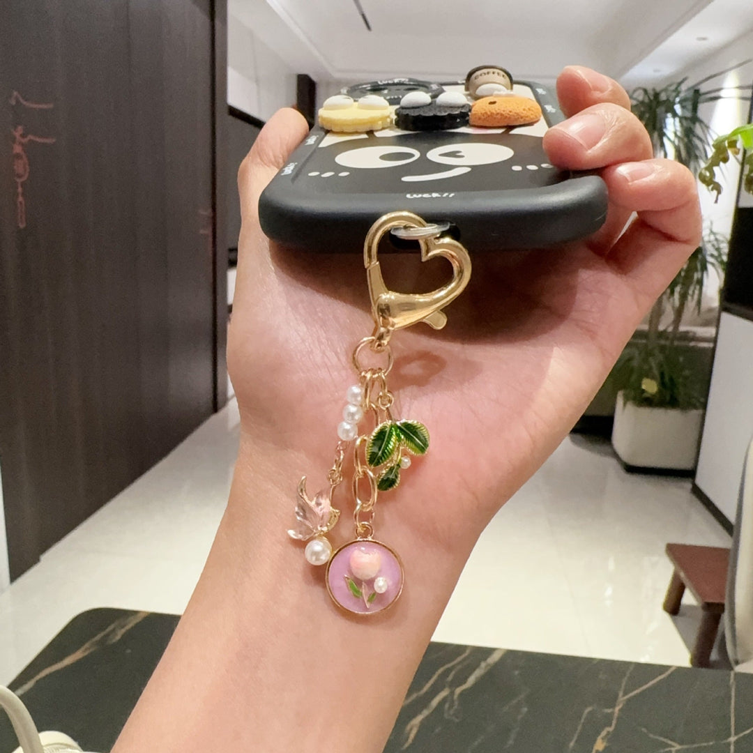 Women's elegant rose flower keychain, perfect metal accessory for keys, purses, or bags.