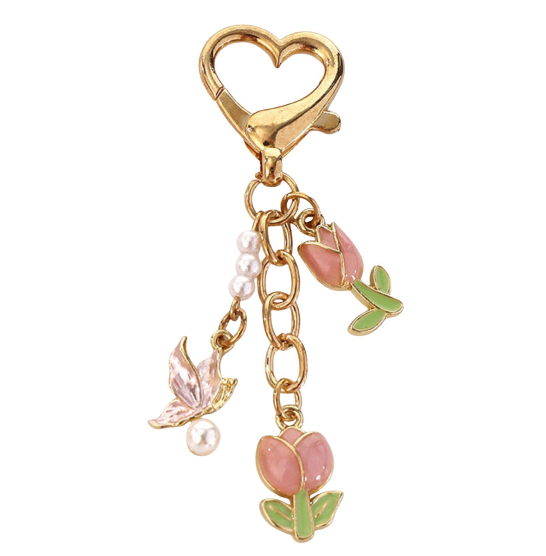 Detailed metal rose flower keychain with enamel accents, an elegant women's bag charm.