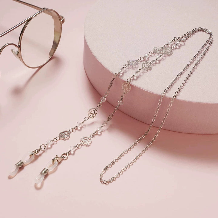 Elegant rose gold floral glasses holder chain, a practical fashion accessory that adds a touch of style to any outfit.