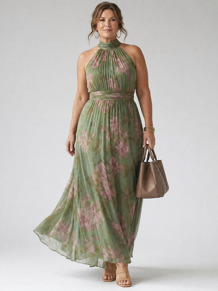 Sophisticated sage green midi dress with a gathered halter neckline, great for warm weather.