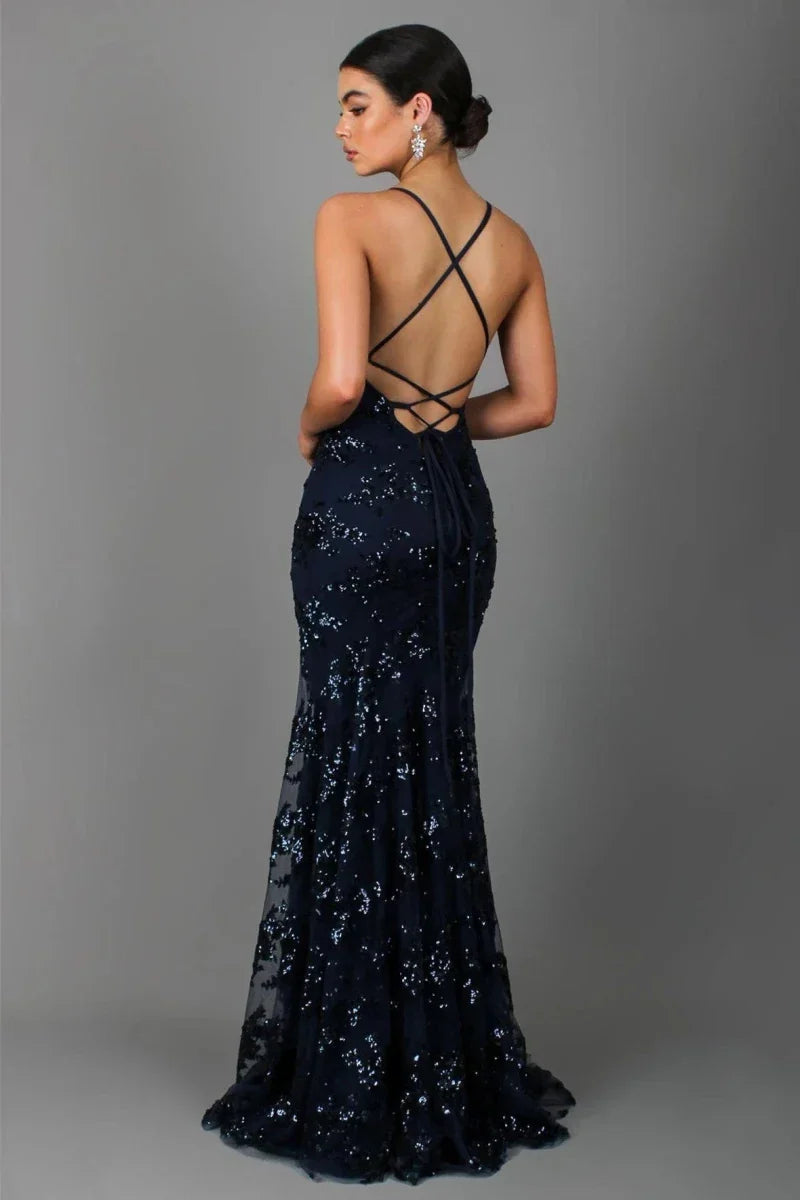 Sparkling V-neck sequin evening gown with delicate spaghetti straps & elegant open back.