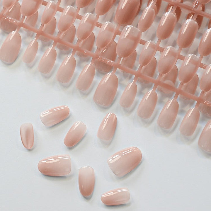 Short almond acrylic press-on nails for women. Stylish fake nails, ideal for elegant nail art & beauty.