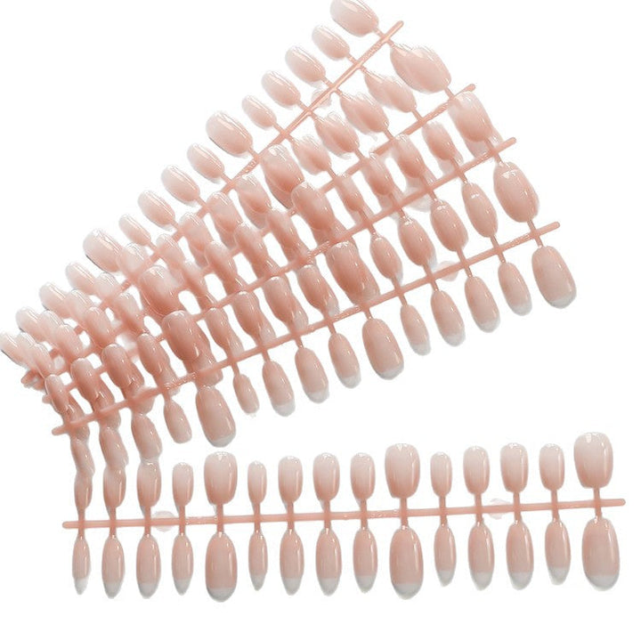 Chic elegant short almond press-on acrylic nails. Reusable fake nails for a quick, sophisticated women's manicure.