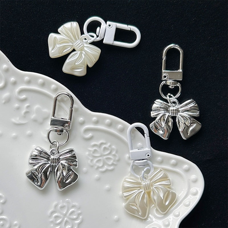 Chic bow pendant charm featuring a smooth, polished finish, an ideal women's jewelry accessory for gifting.
