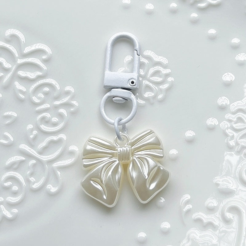 Stylish women's bow pendant charm, a must-have elegant accessory for necklaces, bracelets, or as a bag charm.