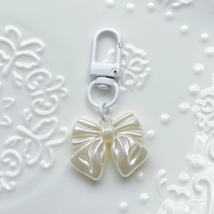 Stylish women's bow pendant charm, a must-have elegant accessory for necklaces, bracelets, or as a bag charm.