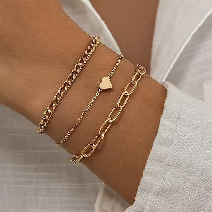 Elegant silver & gold chain bracelet set for women, ideal for layering. A chic fashion accessory.
