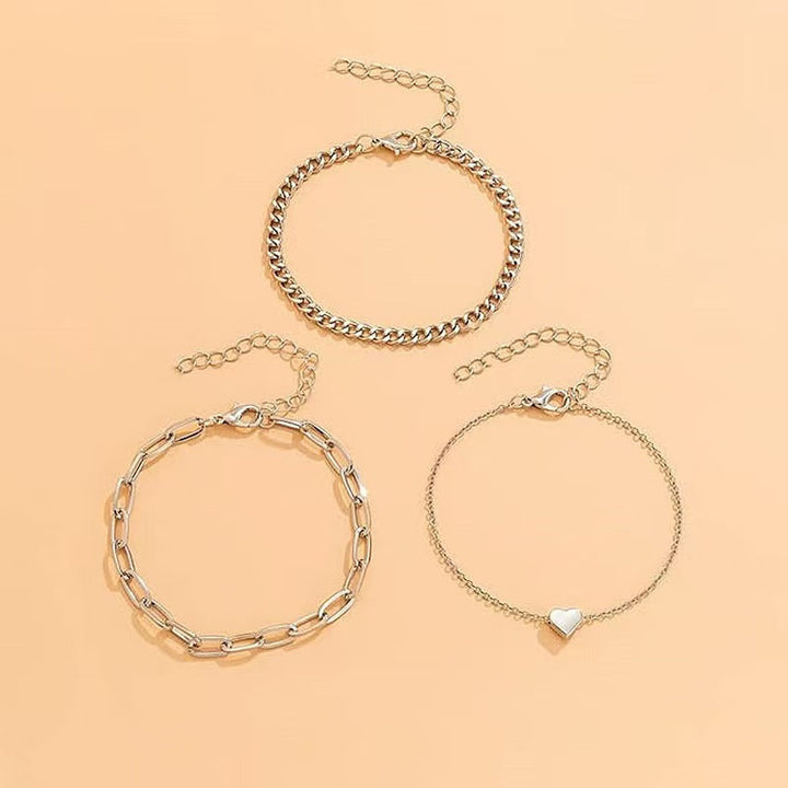 Stylish women's layered chain bracelet set, featuring gold & silver tones for an elegant look.