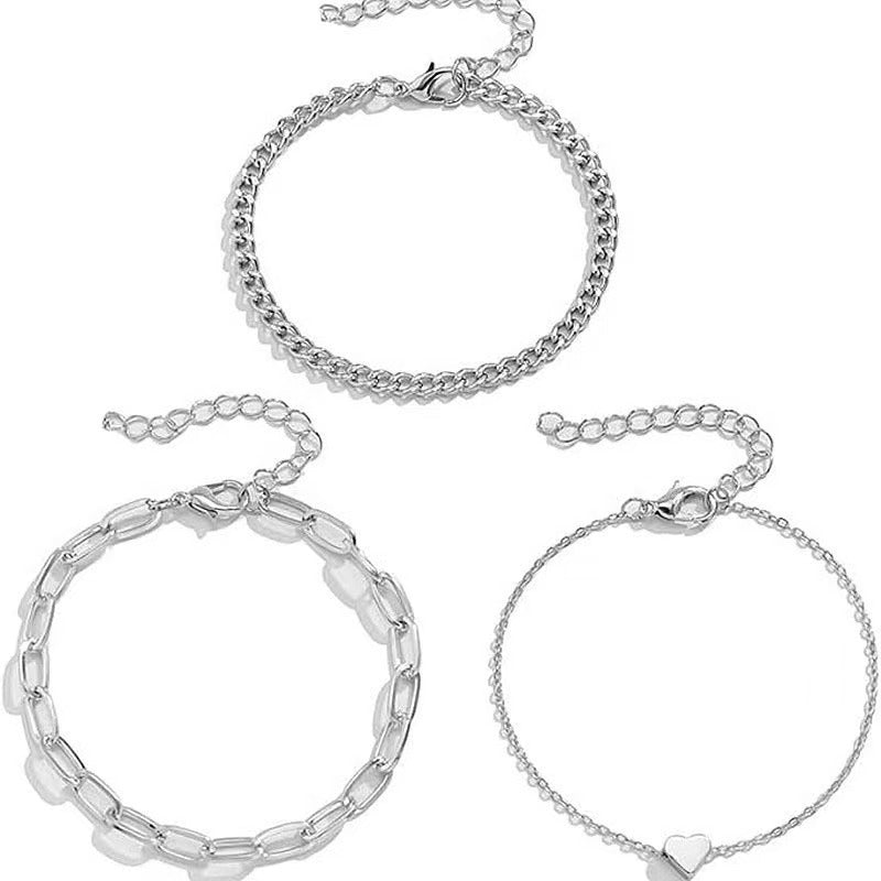 Chic women's gold & silver chain bracelet set, an elegant & adjustable fashion accessory for layering.