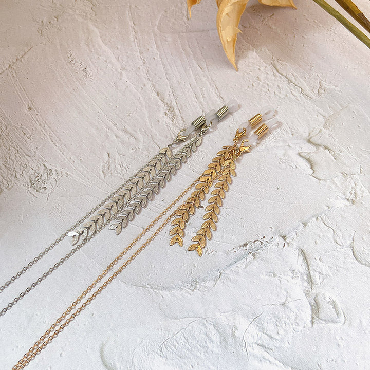 Women's shimmering silver leaf drop earrings. Elegant statement jewelry, hypoallergenic design for sensitive ears.